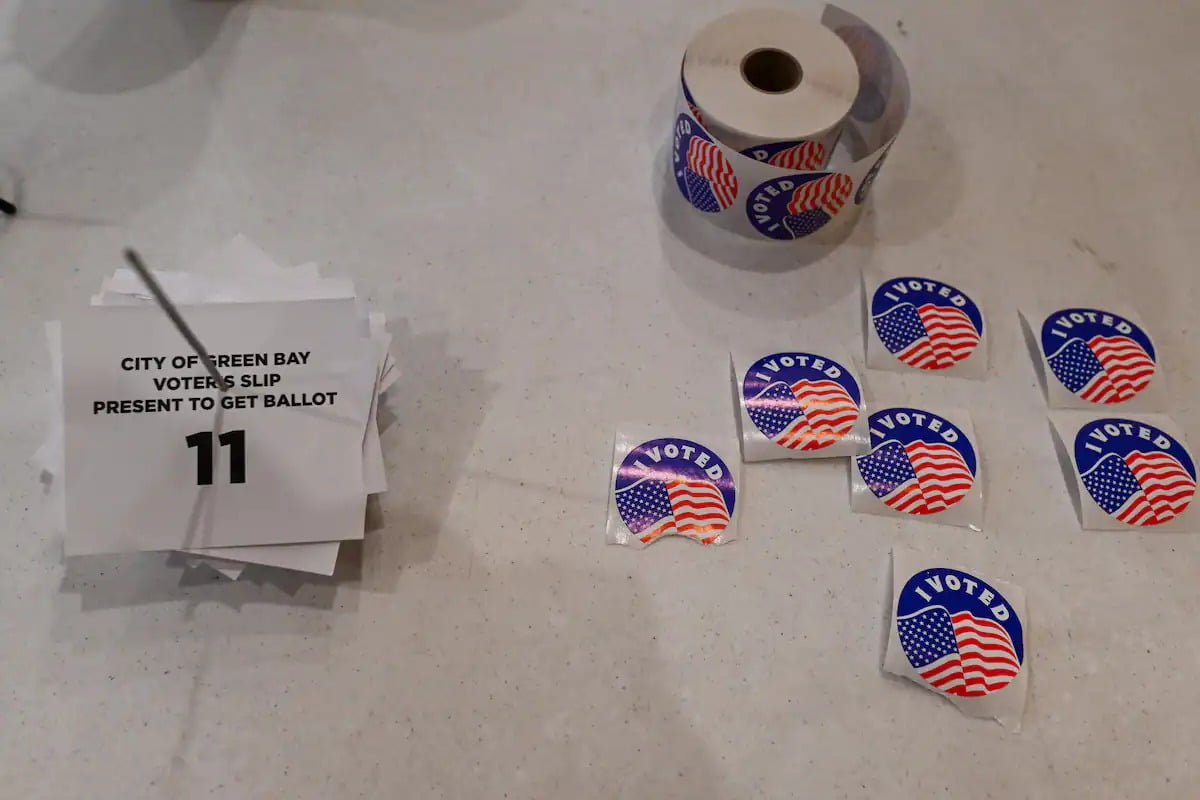 Voting stickers are displayed on a table at a polling station in Green Bay Wisconsin on Tuesday Wisconsin Voters Ban Private Funding of Elections