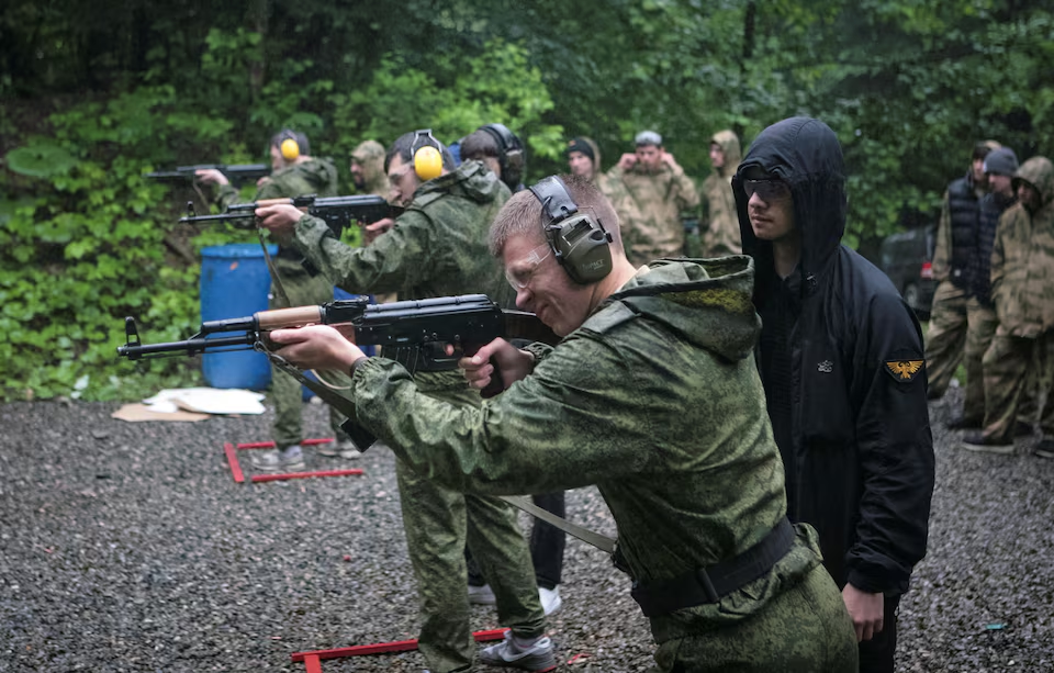 image 118 In Russia at war, kids swap classroom for shooting range