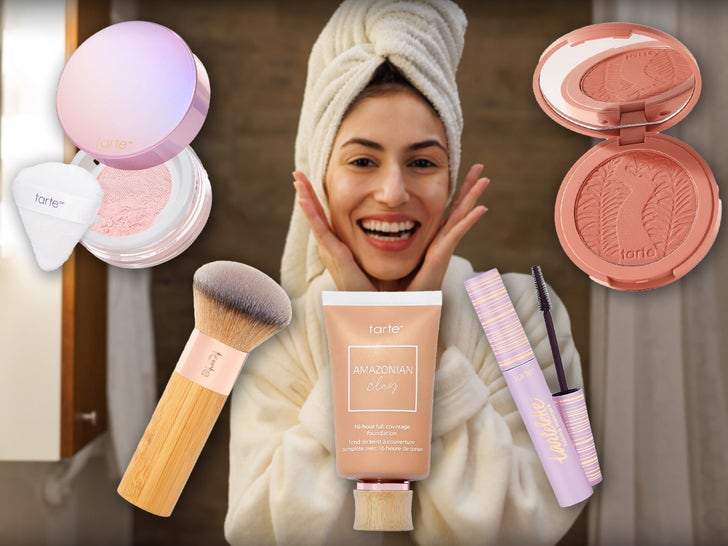 Woman In The Bathroom Surrounded By Tarte Beauty Products