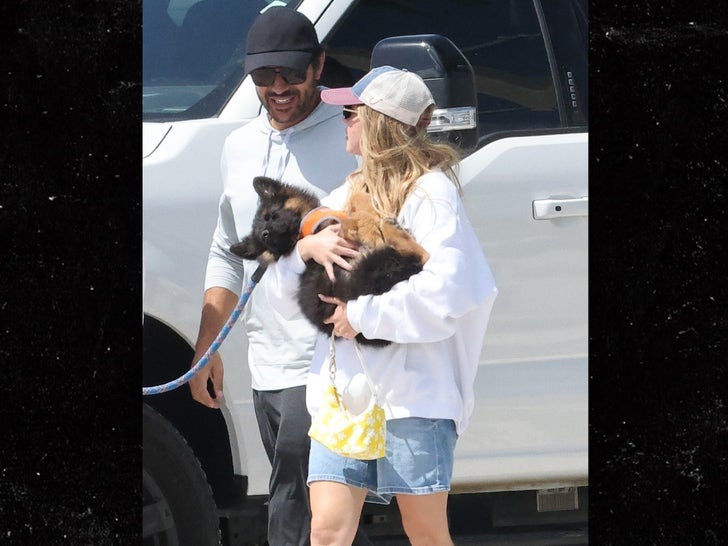 0422-Sydney-Sweeney-And-Jonathan-Davino-Walk-Together-While-Holding-A-New-Puppy-primary-2