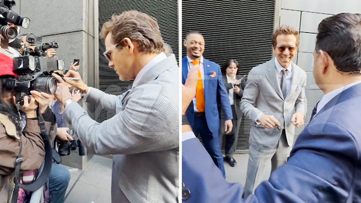Ryan Reynolds Pretends to Sign Paparazzi Cameras at 'Another Simple Favor' Event 042725_ryan_reynolds_kal