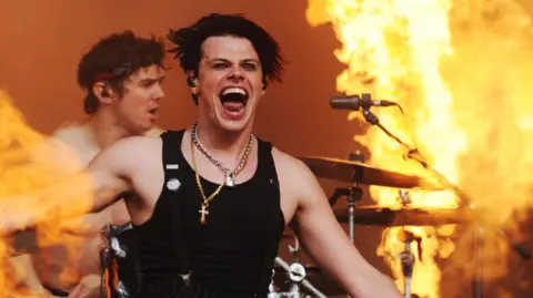 UK festivals that still have tickets left YungBlud performing on stage surrounded by jets of flame