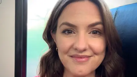 TikTok Shop food listings 'putting people at risk' Kate Lancaster Selfie of Kate Lancaster who has a brown bob hairstyle and is seen smiling on a train