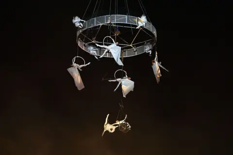 The 1975, Alanis Morissette and more to star on first day of music Getty Images Trapeze artists perform at Glastonbury
