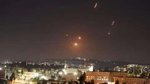 Israel's endgame may be regime change in Iran EPA-EFE/Shutterstock Missiles launched from Iran as seen over Jerusalem in a wide shot over the city