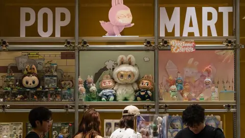 How the Pop Mart dolls conquered the world Getty Images Customers browse a Pop Mart display filled with Labubu characters and collectible figures from The Monsters series on June 16, 2025 in Chongqing, China.