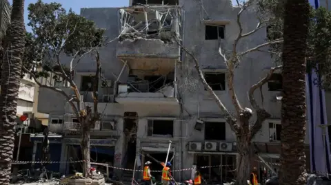 UK preparing flight out of Israel for British nationals next week Reuters The site of a missile strike in Haifa
