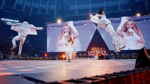 Cowboy Carter dazzles a nearly sold-out stadium Parkwood Entertainment Beyoncé performing on stage in all-white.