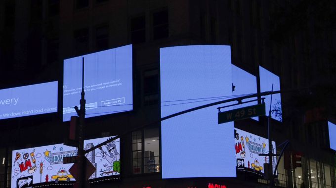 Week in Review: Meta's AI recruiting blitz Times Square billboards displaying Windows blue screen of death after CrowdStrike outage on July 19, 2024.