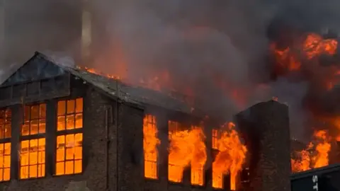 Residents evacuated from tower as blaze spreads Kiyan Beasant Image shows the inside of Hotspur House, a brick-built Victorian building, raging with fire. Everything inside the frames of the windows burns bright orange.
