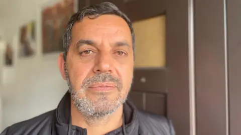 A neighbour threatened dad with a knife Ecevit