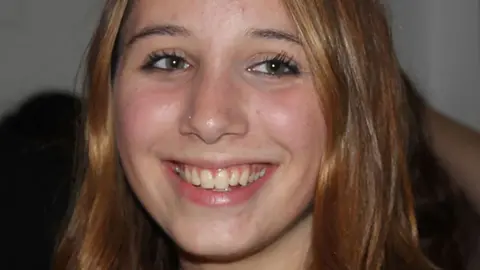 NHS trust and medic guilty of failings Figueiredo family Alice Figueiredo close-up on face. She smiles and looks slightly off-camera
