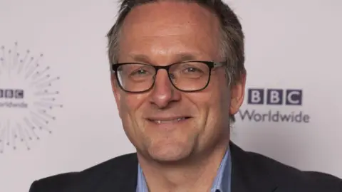 Michael Mosley's family say year since his death has been 'hardest of our lives' BBC/PA Media Michael Mosley smiling while wearing glasses