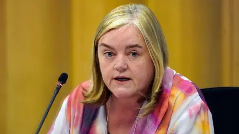 Ethnicity of grooming gangs 'shied away from', Casey report says PA Media Casey in a multicoloured top talks into a microphone during a press briefing in March 2023