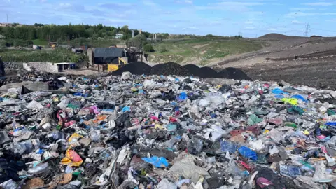 Truckloads of Scotland's rubbish will be exported to England, say experts BBC A mountain of rubbish on a landfill site in Glasgow