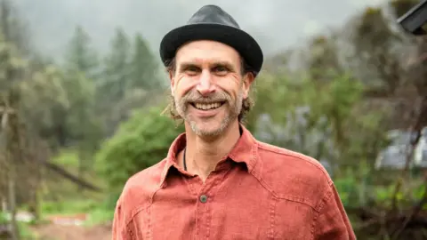 The global environmental award hit by accusations of greenwashing Dr Bronner's Dr Bronner's chief executive David Bronner smiles at the camera