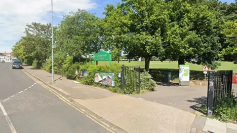 Children among casualties after tree falls in park Google The entrance to Chalkwell Park with open black gates and a green sign with the name on. There are lots of mature trees around the edge, and a large lawn behind them.