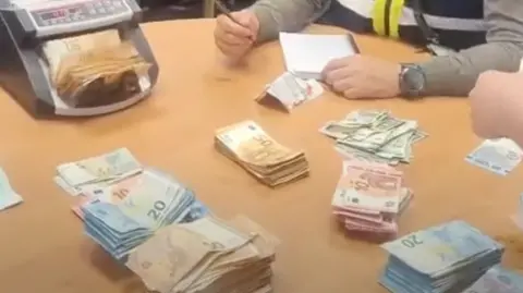 48 arrested in international cocaine gang bust Europol A large quantity of cash on a table