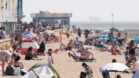 Amber heat health alerts issued as temperatures to soar PA Media Southend beach scene