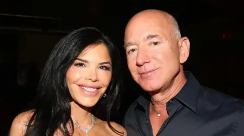 Getty Images Lauren Sanchez and Jeff Bezos smiling at the camera 
