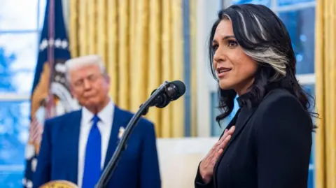 Tulsi Gabbard now says Iran could produce nuclear weapon 'within weeks' Jim Lo Scalzo/EPA/Bloomberg via Getty Images Gabbard with her hand over her heart speaking in front of a microphone in the Oval Office, while Trump can be seen out of focus in the background