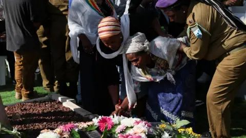 Hamas official says Gaza mediators intensifying ceasefire efforts Reuters The mother of Israeli soldier Sgt Shahar Manoav is assisted as she mourns over her son's grave, during his funeral in Ashkelon, Israel (25 June 2025)