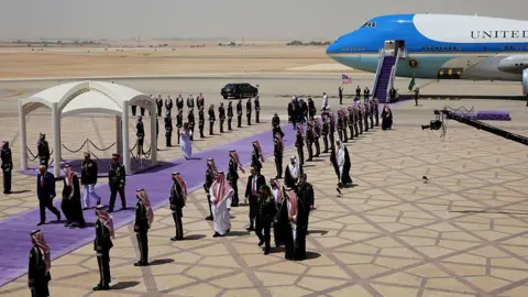 Did Trump really strike Gulf deals worth $2tn? Getty Images Trump walking through a guard of honour with Saudi Crown Prince Mohammed bin Salman upon landing in Riyadh