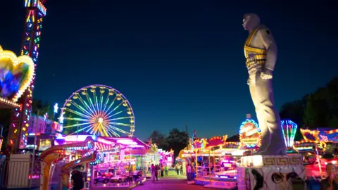 Where are Michael Jackson's giant HIStory statues 30 years later? Marino Trotta A brightly light fairground at night with a large Michael Jackson statue towering on the right side. His badges and bandolier are painted gold.