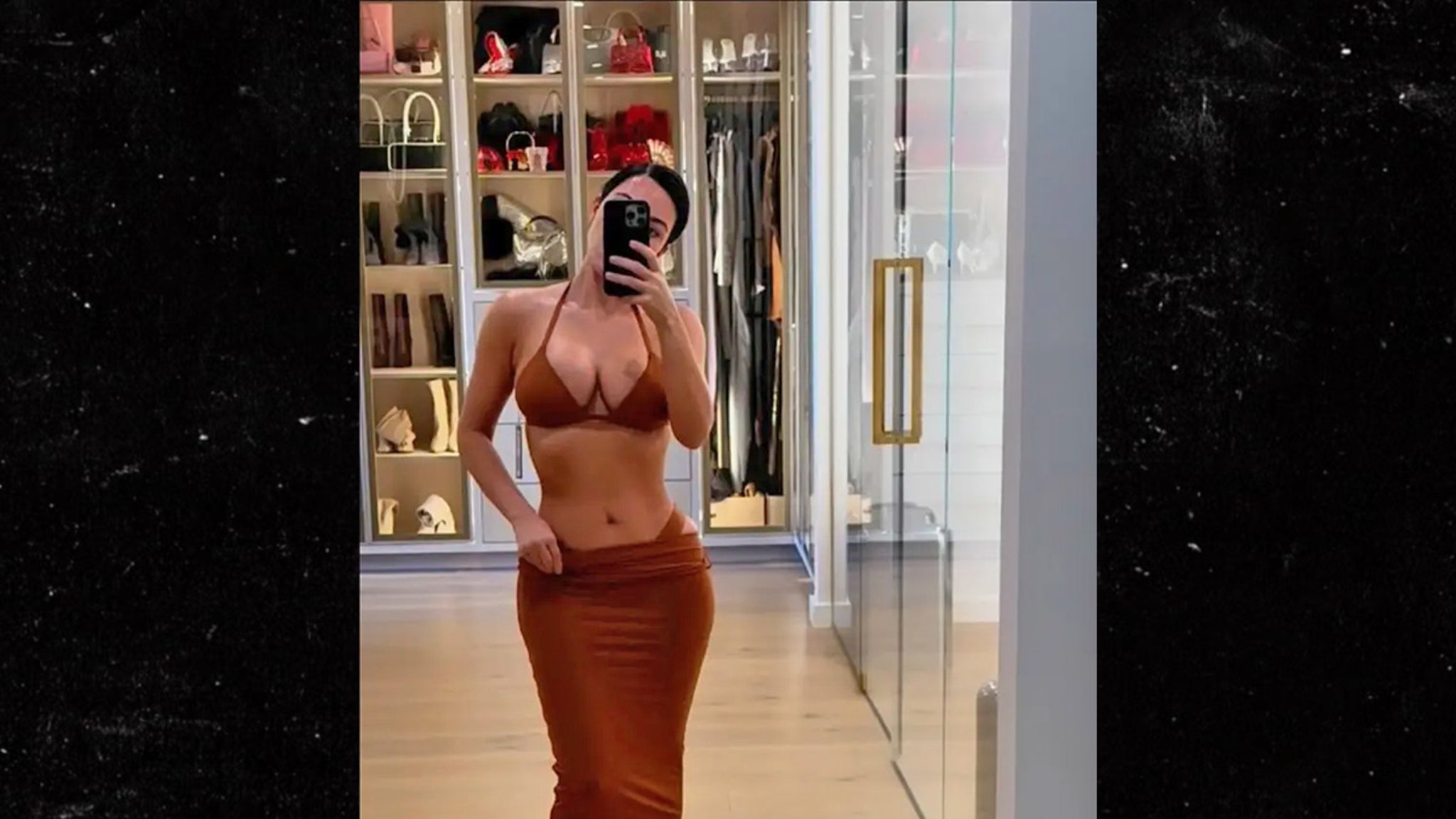 Kim Kardashian Models Skimpy Bikinis in Lavish Bedroom