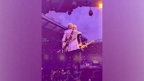 Bruce Springsteen and Paul McCartney in surprise Liverpool duet Heart of Liverpool Tours Sir Paul McCartney and Bruce Springsteen hug each other as they hold guitars on stage.