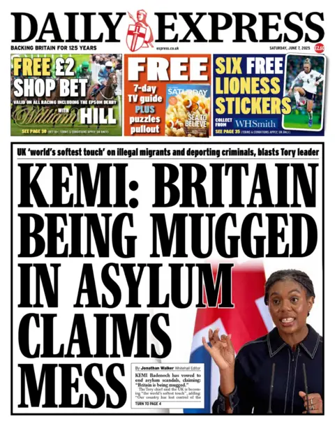 THE DAILY EXPRESS The front page of the Daily Express read: Kemi: Britain being mugged in asylum claims mess