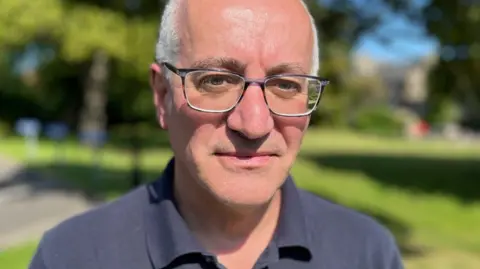 Dundee University bosses quit after damning report into financial collapse Dr Carlo Morelli