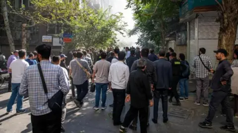 Your questions answered on the Israel-Iran conflict Reuters A crowd of Iranians in Tehran