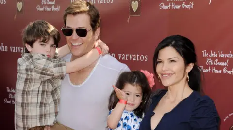 Getty Images Patrick Whitesell (L), his wife Lauren Sanchez and their children Evan and Ella in 2011