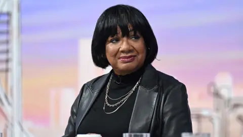 Sir Keir Starmer says fixing welfare system is a 'moral imperative' Diane Abbott is wearing a black leather jacket.