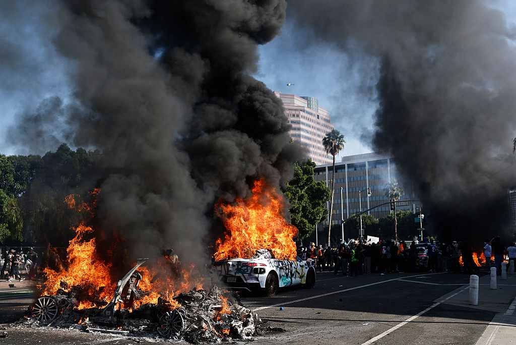 GettyImages 2219268737 Waymo robotaxis, Lime e-scooters set ablaze during LA protests
