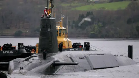 Shaping Scotland's priorities for years to come Reuters A Vanguard class submarine in dock at Faslane. Three submariners in uniform can be seen on the deck