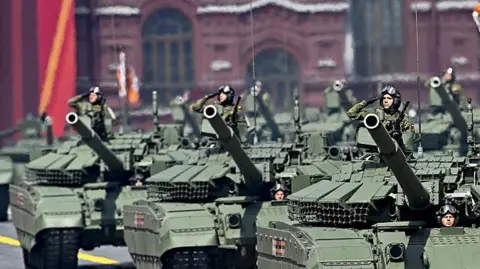 Russia's economy is down but not out Getty Images Russian tanks in Red Square, Moscow, last month