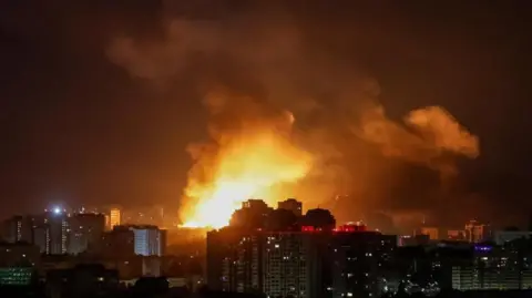 At least 14 killed and dozens injured in Russian strike on Kyiv Reuters An explosion of a drone lights up the sky over the city during a Russian drone strike