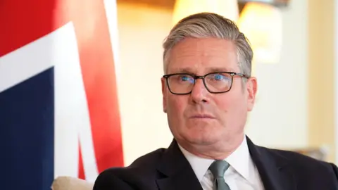 Keir Starmer calls for Iran to return to negotiating table PA Media A headshot of Keir Starmer with a Union Jack in the background.