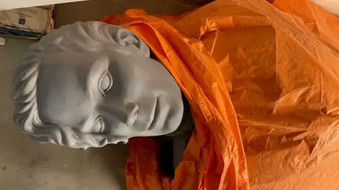 Where are Michael Jackson's giant HIStory statues 30 years later? Peter Van Gelder The head of a Michael Jackson statue peeks out from under an orange sheet in a warehouse.