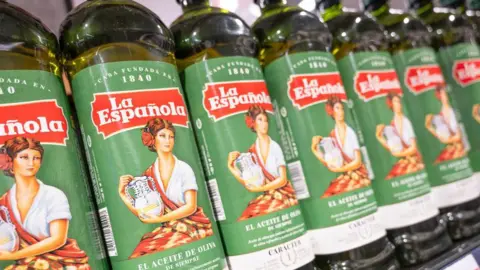 US tariff turmoil makes Spain's flagship foods seek other markets Getty Images Bottles of Spanish olive oil