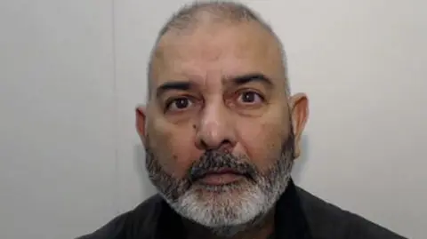 Rochdale gang guilty of raping and abusing girls for five years GMP A mugshot of Mohammed Zahid