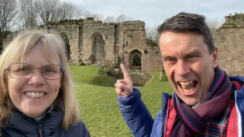 World-first 'Trojan horse' therapy to be given on NHS Paul Silvester Paul and his wife are grinning at the camera, with a ruin in the background