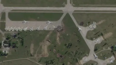 Are the surprise airfield attacks a turning point for Ukraine? PLANET LABS/REUTERS A satellite view shows military aircraft, some sitting destroyed, at the Belaya air base, near Stepnoy, Irkutsk region, Russia, June 4, 2025