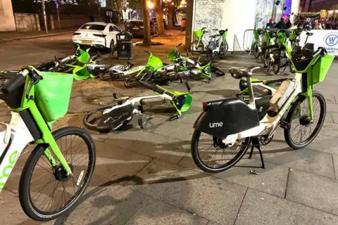 Lime bikes dumped in canals and rivers 'posing pollution risk' Getty Images Lime bikes outside Waterloo Station in London, October 2023