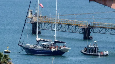 Six Gaza aid boat activists deported from Israel AFP An Israeli patrol boat near the Madleen yacht as it moored at the port of Ashdod in Israel on 10 June.