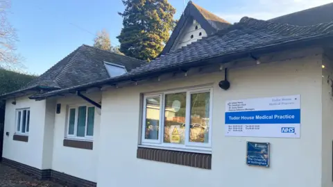 Behind the scenes at a GP 8am scramble A picture of the Tudor House Medical Practice an inner city surgery in Nottingham.