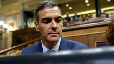 Embattled Sánchez resists clamour for resignation EPA Spanish Prime Minister Pedro Sánchez attends the government control session at the Lower House of Parliament. The photo is a close up of Sánchez looking down.