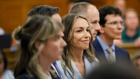 Karen Read found not guilty of murdering police officer boyfriend The Patriot Ledger/Reuters Karen Read smiles as the not guilty verdict is read during her trial. She is wearing a light blue suit and is flanked by her legal team.